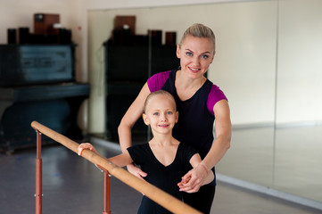 Coach teaches girl Ballet