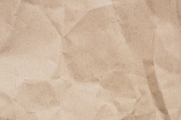 Recycled crumpled light brown paper texture or paper background
