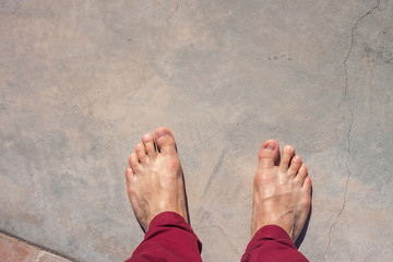barefoot on concrete surface