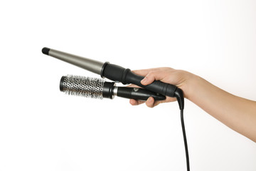 Barber Hand holdinr curling hair and comb.