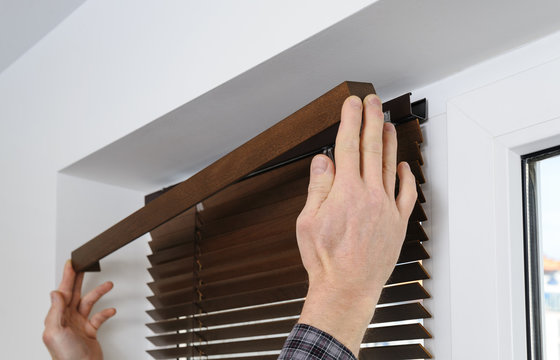 Installing Wooden Blinds.