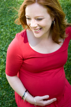 Portrait of a smiling red head pregant women