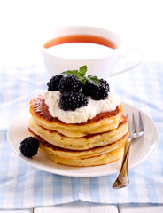 Pancakes with sour cream and blackberry