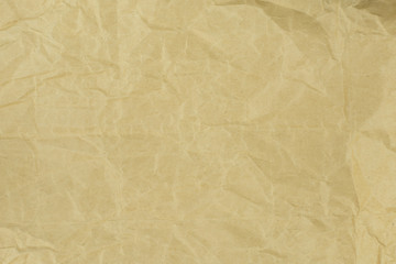 Recycled crumpled light brown paper texture or paper background