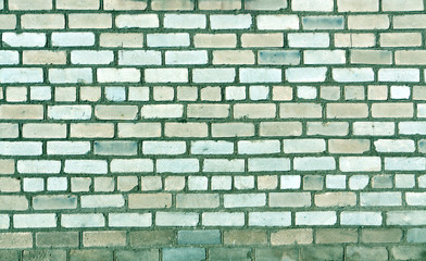 Old brick wall texture in cyan tone.