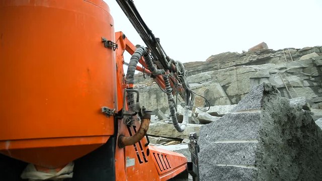 Drilling drill in granite quarry