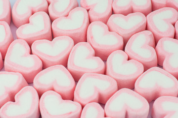 Obraz premium Pink heart shaped marshmallows background