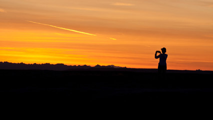 Fototapeta premium photographer at sunset