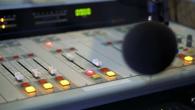 Sound mixer and microphone in the broadcasting studio on radio