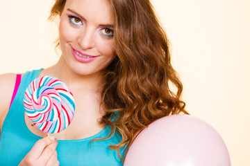 Woman joyful girl with lollipop candy