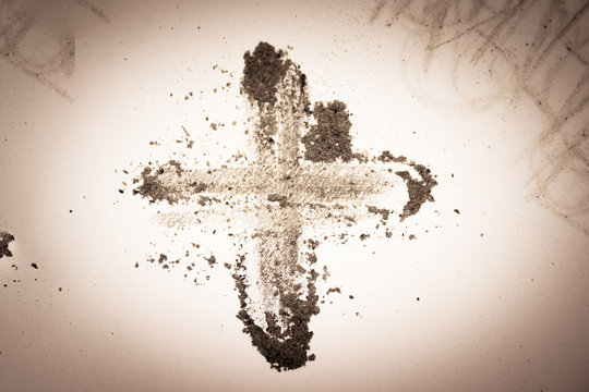 Cross made of ashes, purple Lent season background