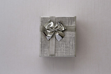 Gift box over silver background