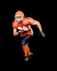 Professional american football player on black background