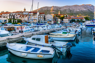 Obraz premium Korcula town center marina. / Sunset view at marina and promenade in Korcula town, croatian travel places. 