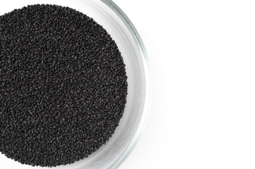 Basil seeds close up shot on white background.