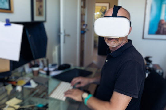 Man Using Vr Goggles In His Office, Working At Computer