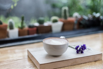 Cup of Latte in coffee shop background