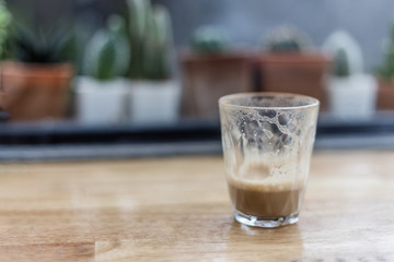single empty glass of coffee espresso cup close up on the wooden