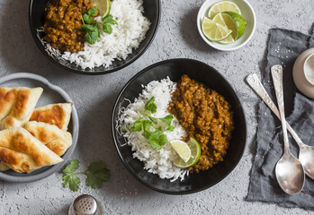 Cream coconut lentil curry with rice and naan bread - vegetarian lunch. Top view, flat lay....