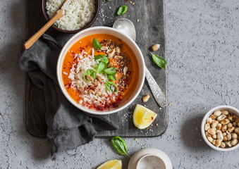 Thai carrot sweet potato soup with rice on the dark table, top view. Flat lay