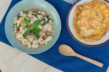 Spicy fried chicken with basil leaves that serve with thai omele