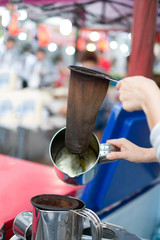 make old coffee bag , pot With tool . Street food and drink Thailand .