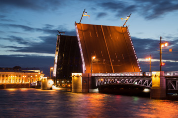 Fototapeta na wymiar Divorced Palace bridge - the symbol of Saint-Petersburg close-up of the June night. Russia