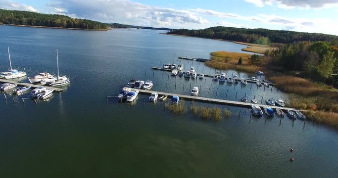 Cinema 4k aerial view on boats, in Sarkisalo, at Isoluoto,in the finnish archipelago, in Varsinais-Suomi, Finland