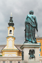 Fototapeta na wymiar Monument to Mozart and Salzburg Cathedral