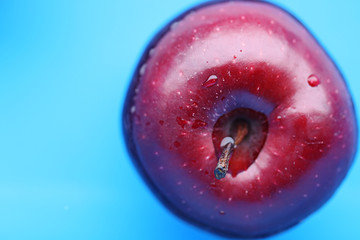 burgundy apple in the blue water