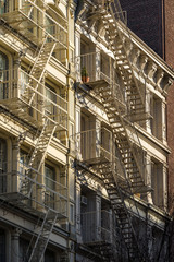 Fototapeta na wymiar Soho building facades with fire escapes. Manhattan, New York City