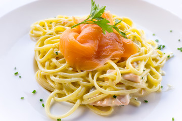tasty pasta with salmon on a the table