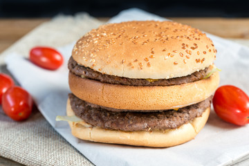 Fototapeta na wymiar delicious American cheese burger with tomato