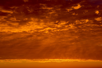 Obraz premium Sunrise sky covered with colorful clouds in various shades