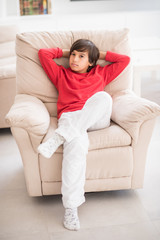 Obraz premium Kid relaxed on sofa