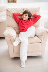 Obraz premium Kid relaxed on sofa