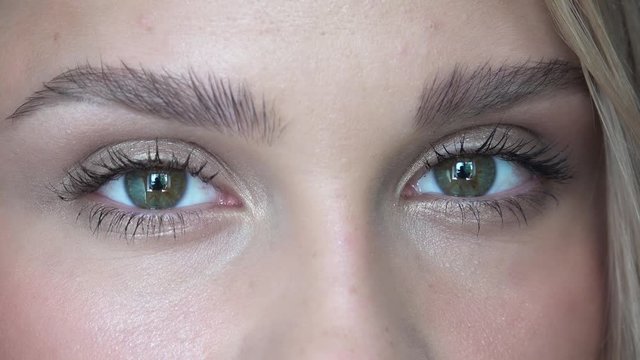 Closeup video of female eyes with day face makeup