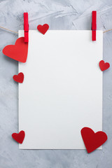 Valentine, love background with paper and hearts on a rope