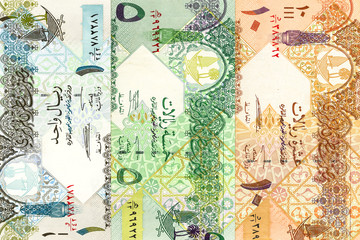 heap of qatari riyal bank notes background