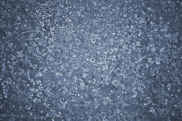 Icy pattern on frozen window.