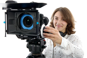 Naklejka premium beautiful young woman with DSLR video camera
