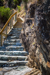 Start of the long steep staircase with stone steps at the coast, South Island, New Zealand