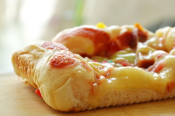 pork sausage bread with mayonnaise and butter on wooden chop block