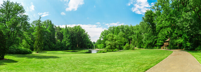 Lake and side walk in the spring park - obrazy, fototapety, plakaty