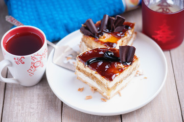 Pieces of cake, metal paddle and cup of tea 