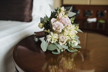 Closeup of a wedding bouquet on bench indoors