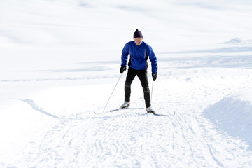 Fototapeta na wymiar The Cross-country Skier in the mountains.