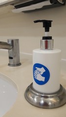 Fototapeta na wymiar Hand sanitizers, near the bathroom sinks