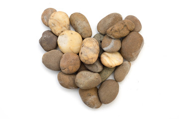 Fototapeta premium Stones in heart shape with white background.