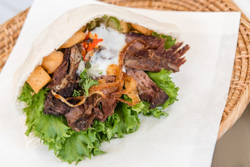 pita bread stuffed with roasted lamb